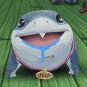 Jeff the shark with a goofy expression and blue drool hanging from his mouth while wearing a gold name tag.