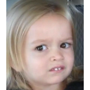 A young girl with blonde hair giving a skeptical, side-eye expression.