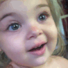 Toddler making a skeptical side-eye expression with a slight smirk.