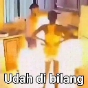 Person standing with hands on hips with the text Udah di bilang overlaid on the image.