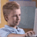 A young boy giving a thumbs up gesture with a cool, satisfied expression.