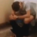 Person sitting with their head bowed in their hands in a gesture of defeat.