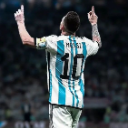 Lionel Messi wearing an Argentina jersey with his back to the camera, pointing both index fingers toward the sky in celebrat…
