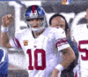 Eli Manning wearing a white Giants jersey with a confused and frustrated expression.