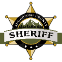Sheriff badge featuring a gold star, mountain silhouette, and the text Snohomish County Sheriff.