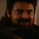 Billy Butcher with a wide, manic, and unhinged grin on his face.