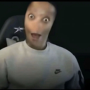 A human face with heavily distorted, stretched features and wide eyes looking shocked.