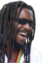 Man with dreadlocks and sunglasses laughing with a wide, joyful expression.