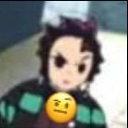 Tanjiro Kamado with a skeptical yellow emoji face superimposed over his own.