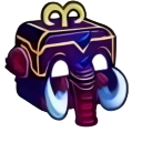 An elephant-like creature with a box-shaped head and white tusks looking forward.