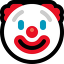 Clown face with a white base, red nose, red hair, and blue eyes smiling.