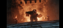 A hulking dark monster stands in front of a massive explosion of fire.