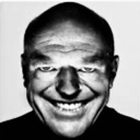 Hank Schrader with a heavily distorted, wide, and unsettling grin.