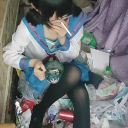 Mikan Tsumiki sitting in a pile of trash while smoking a cigarette.