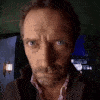 Gregory House slowly zooming in with an intense and suspicious stare.