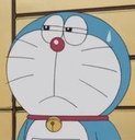Doraemon looking sideways with a nervous, skeptical expression and a sweat drop on his forehead.