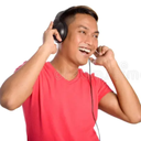 Man wearing black headphones and a red shirt smiling while listening to music.
