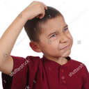 Young boy scratching his head with a confused and skeptical facial expression.