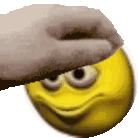 A human hand repeatedly patting the top of a yellow smiley face.