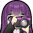 Fern from Frieren holding a pink and black camera up to her face as if taking a photo.
