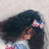 A girl with a bow in her hair dancing joyfully in a series of frames.