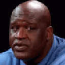 Shaquille O'Neal transitioning from a neutral expression to a wide-eyed look of shock and realization.