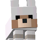 A small, blocky white and brown wolf with a happy expression.