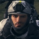 Soap MacTavish wearing a tactical helmet stares intensely at the camera.