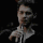 Klaus Mikaelson drinking from a bottle with a smug expression.