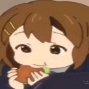 Yui Hirasawa from K-On with a happy expression while eating a piece of food.