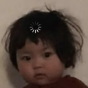 A young child looking blankly with a digital loading spinner icon hovering above their head.