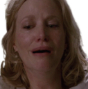 Skyler White with a pained, crying expression on her face.