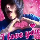 Emo teenager with side-swept hair making a heart shape with their hands against a bright pink background with the text I lov…