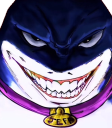 Shark character with a wide, menacing, toothy grin and a gold collar.