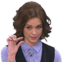 Woman holding her thumb and index finger close together to indicate a tiny amount.