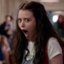 Woman with a wide-open mouth showing a shocked and surprised expression.