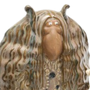 ALF the alien puppet with long brown hair and a neutral, slightly smug expression.