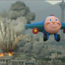 Jay Jay the Jet Plane with a wide, creepy smile flying in front of a massive building explosion.