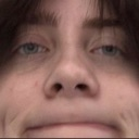 Billie Eilish looking directly into the camera with a deadpan, skeptical expression.