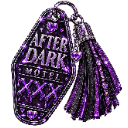 A purple motel keychain with the text After Dark Motel and XXX written on it.