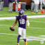 Justin Jefferson performing the Griddy dance on a football field.