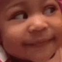 Baby looking to the side with a skeptical and judgmental facial expression.
