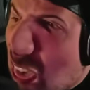 A man's face is heavily distorted and zoomed in, showing a confused and skeptical expression.