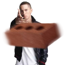 Eminem holding a large brown brick directly toward the camera with a serious expression.