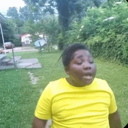 A person with eyes closed and head tilted back in an expression of annoyance or disbelief.