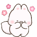 A white cartoon bunny giggling with pink cheeks and small flowers floating around its head.