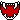 A repeating row of pixelated red vampire faces with prominent white fangs.