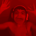 A person wearing headphones with an exaggerated expression, displayed in a four-panel grid with red, green, blue, and purple…