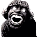A distorted face with a massive open mouth and glowing white eyes staring intensely.