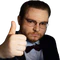 Man in a suit and bow tie giving a thumbs up with a stern, skeptical facial expression.